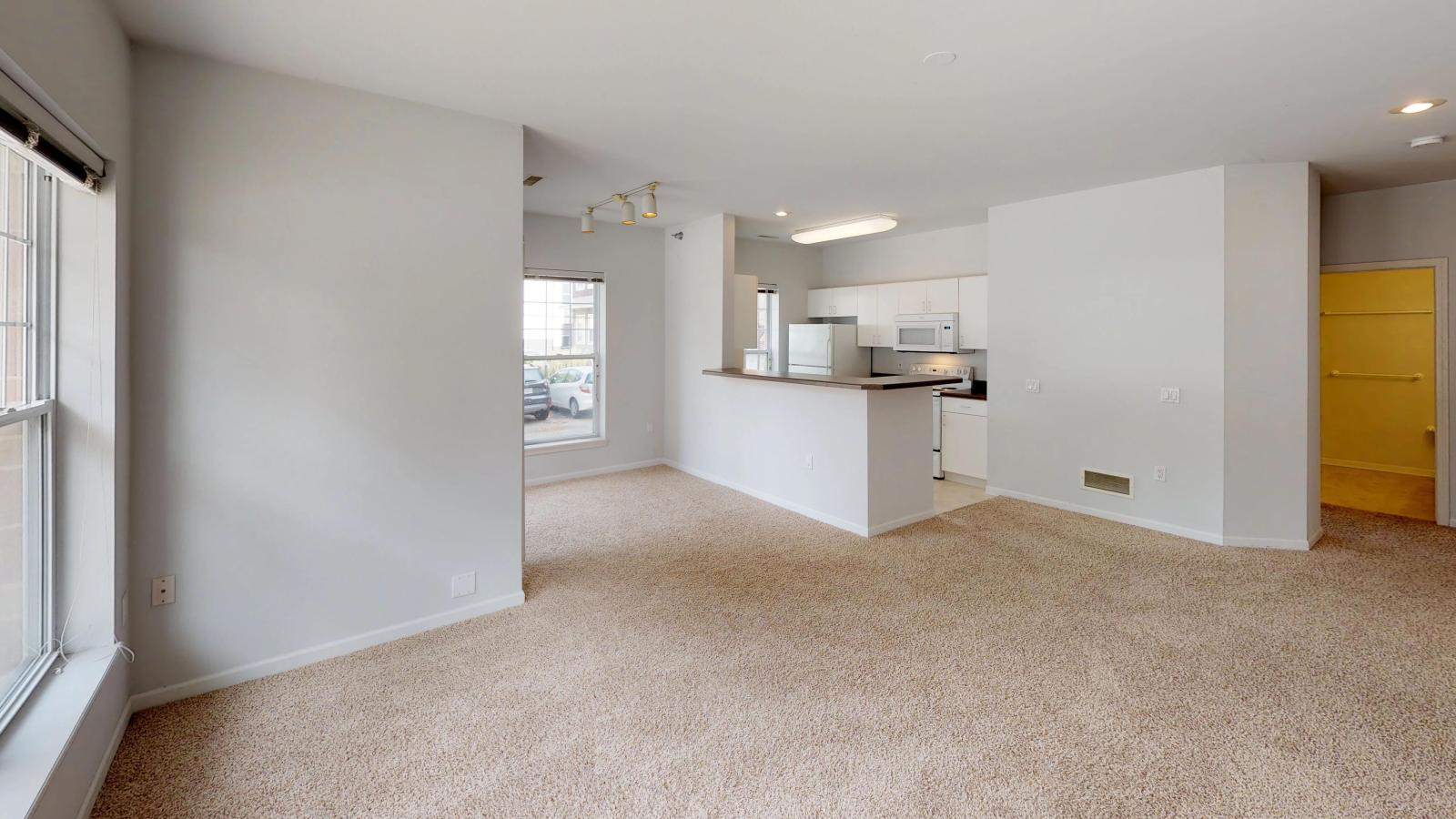 City-Place-107-living room-kitchen-dining room-corner-patio-downtown.jpg