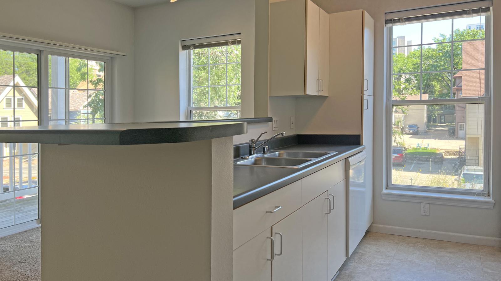 Kitchen with standard appliances and cabinetry at City Place Apartments