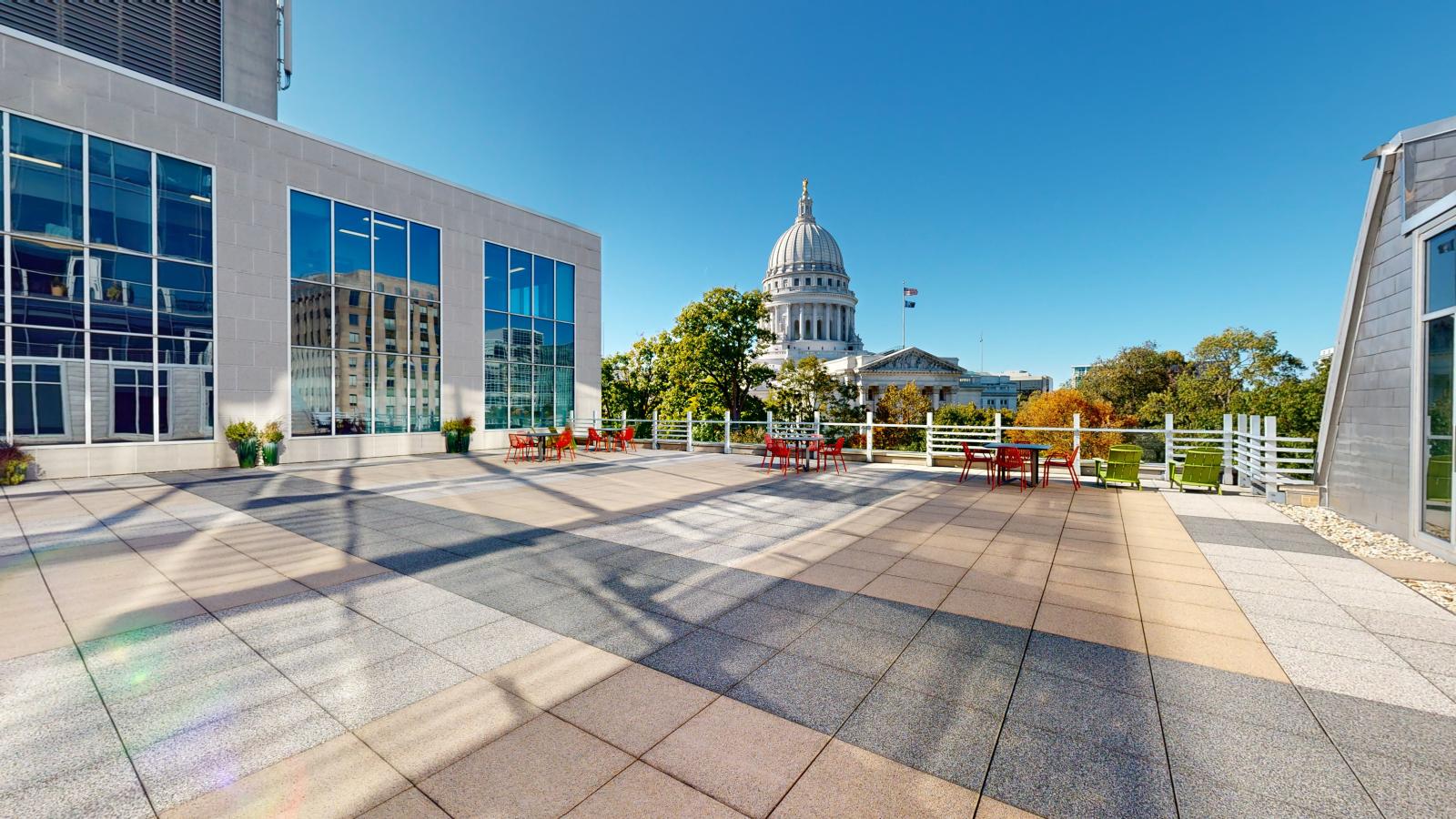 Landscaped rooftop terrace with seating and Capitol views at Block 89