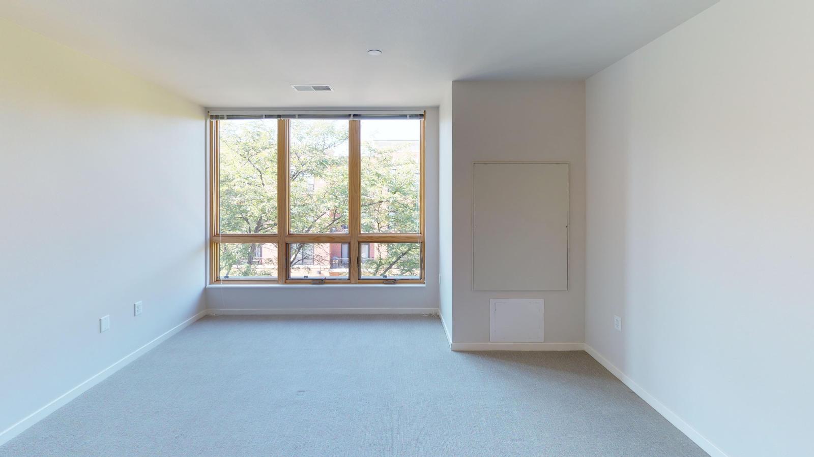 Modern one-bedroom apartment at Quarter Row Apartments in downtown Madison featuring a functional layout, ample storage, and natural light.